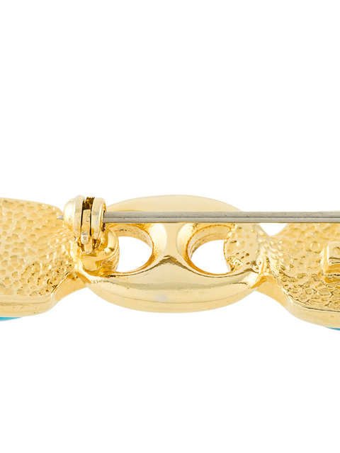 Gucci vintage link and lucite brooch featuring a classic design with transparent lucite and metal detailing.