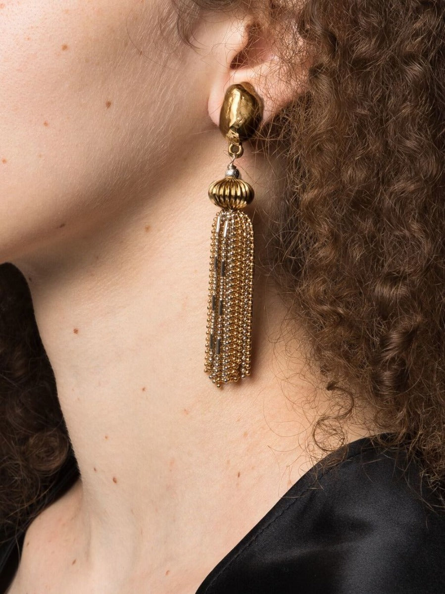 Vintage Finds Goossens gold tangle clip-on earrings with intricate design and textured finish, displayed on a plain background.