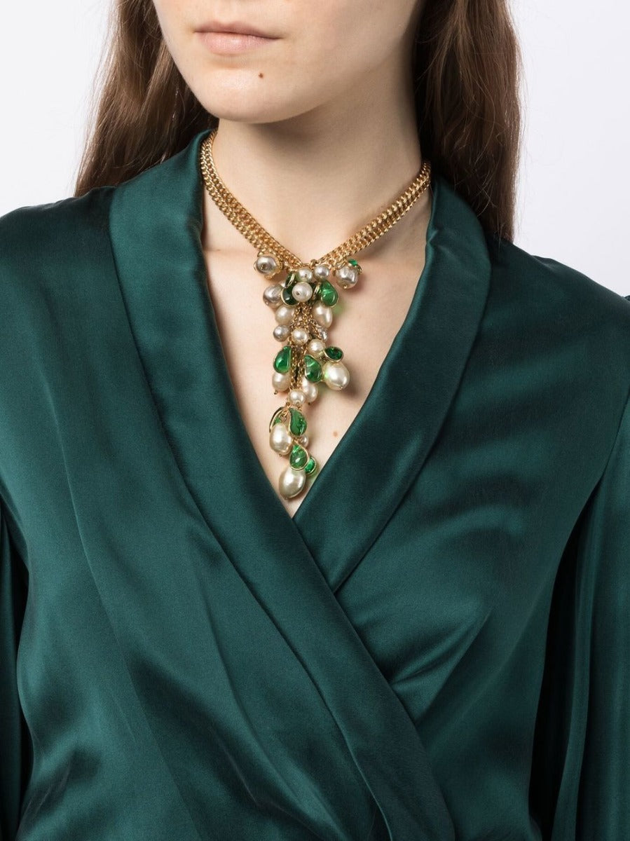 Vintage Finds Green Petal Pendant Necklace featuring a delicate floral-inspired design with vibrant green glass petals.