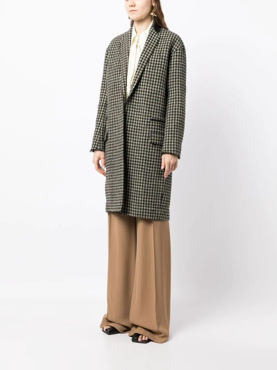 Celine Pre-Fall 2011 Phoebe Philo runway coat in neutral fabric with tailored fit and classic design, displayed on a runway.