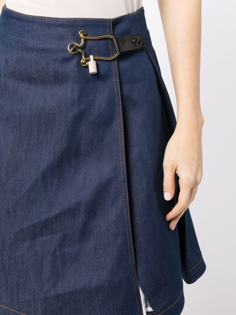 Balenciaga toggle-fastened A-line denim skirt with front buttons and classic denim wash, styled for casual wear.