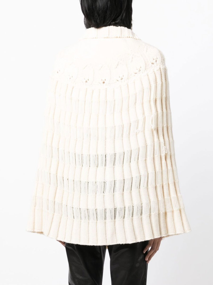 Saint Laurent chunky knit crochet poncho, cozy and stylish outerwear with textured pattern, perfect for layered winter looks.