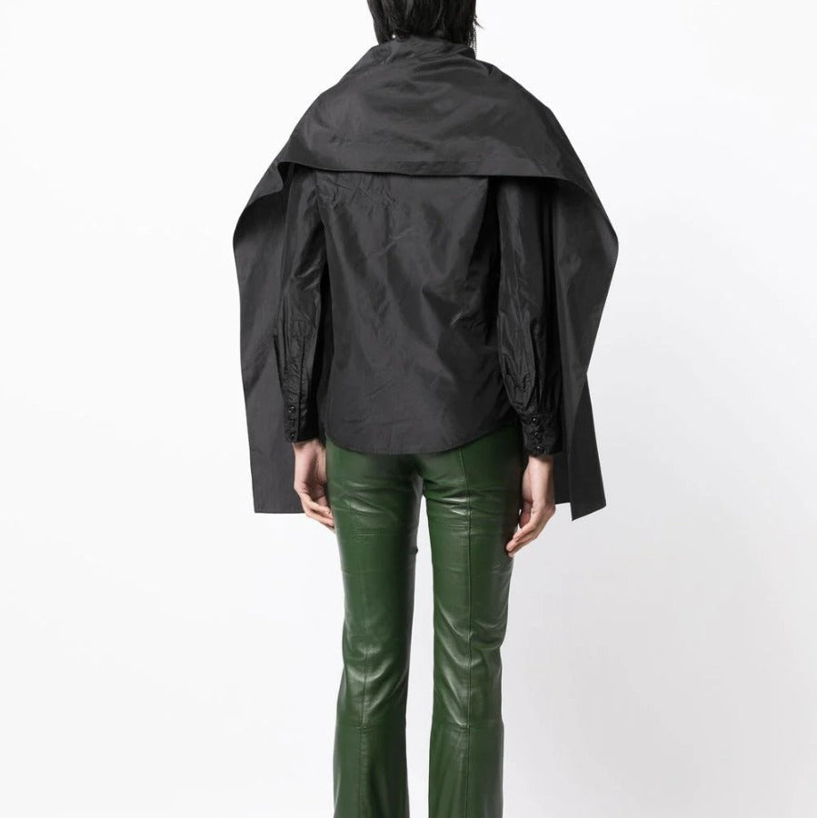 Black layered silk blouse from Yves Saint Laurent, stylish top with flowing fabric and elegant design.
