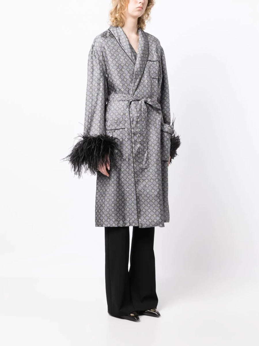 Prada feather-detail silk robe with elegant design, showcasing smooth fabric and intricate feather accents.