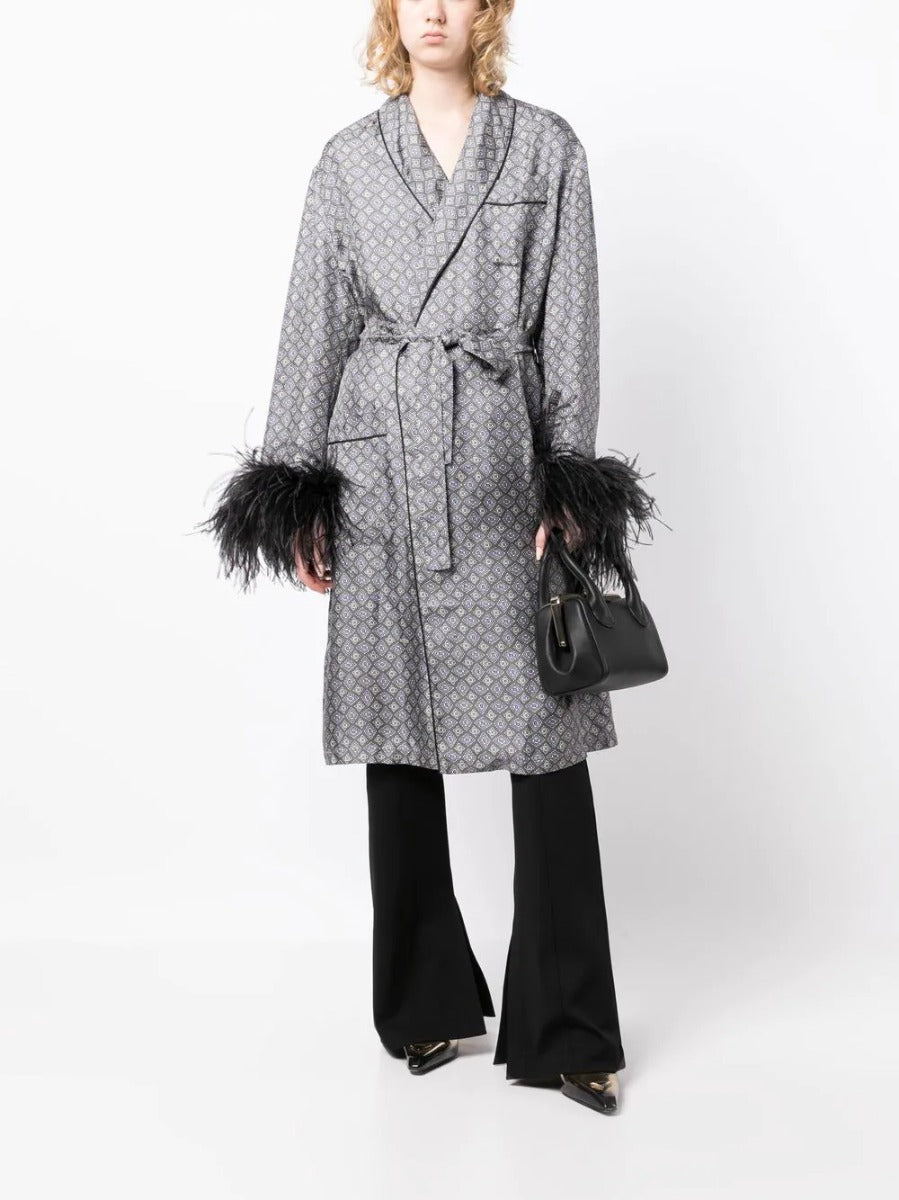 Prada feather-detail silk robe with elegant blazer-inspired design, showcasing luxurious fabric and intricate feather accents.