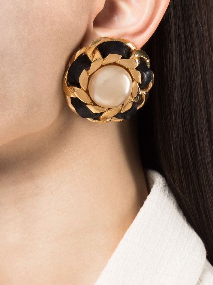 Chanel 1970's pearl button earrings with classic round pearl design and gold-tone setting.