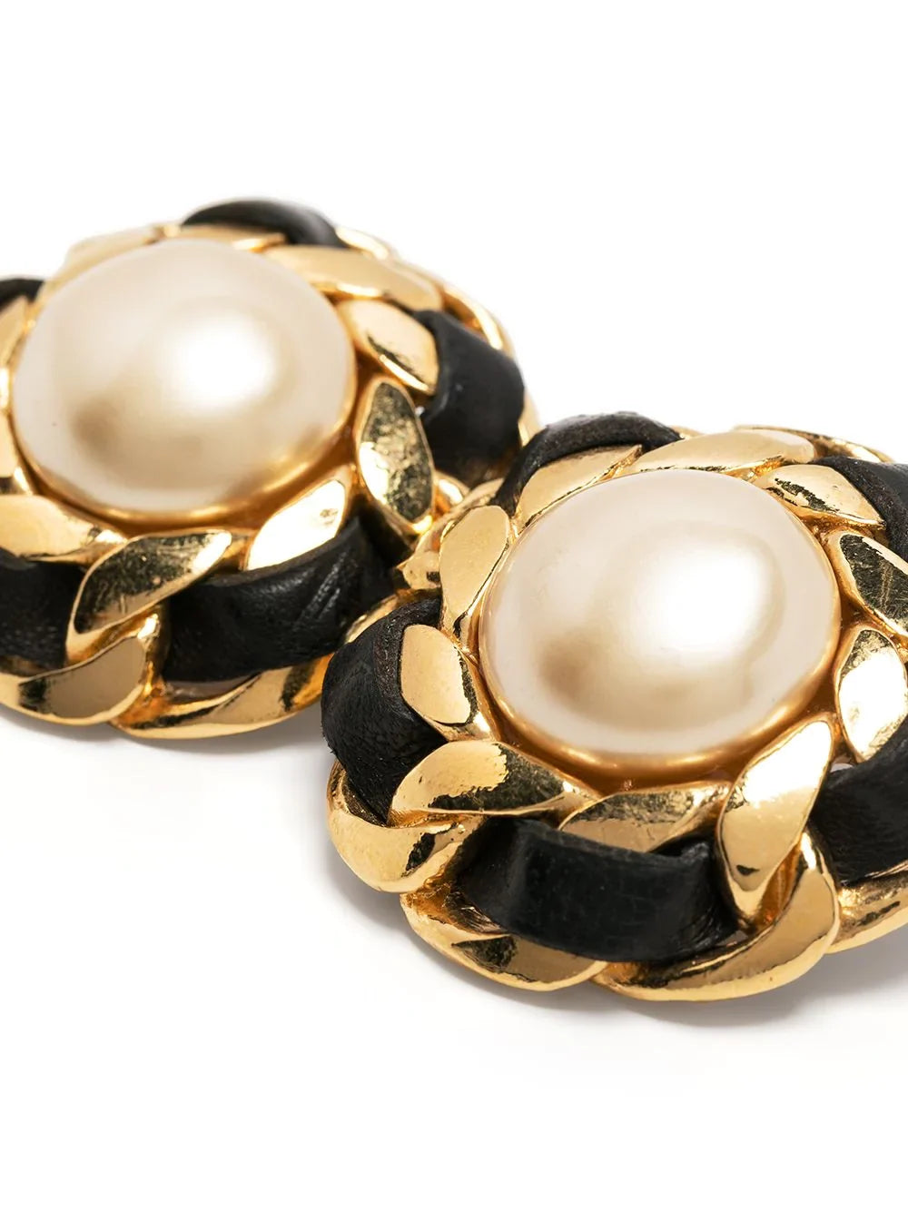 Chanel 1970s pearl button earrings featuring classic round pearls and gold-tone settings, vintage jewelry style.