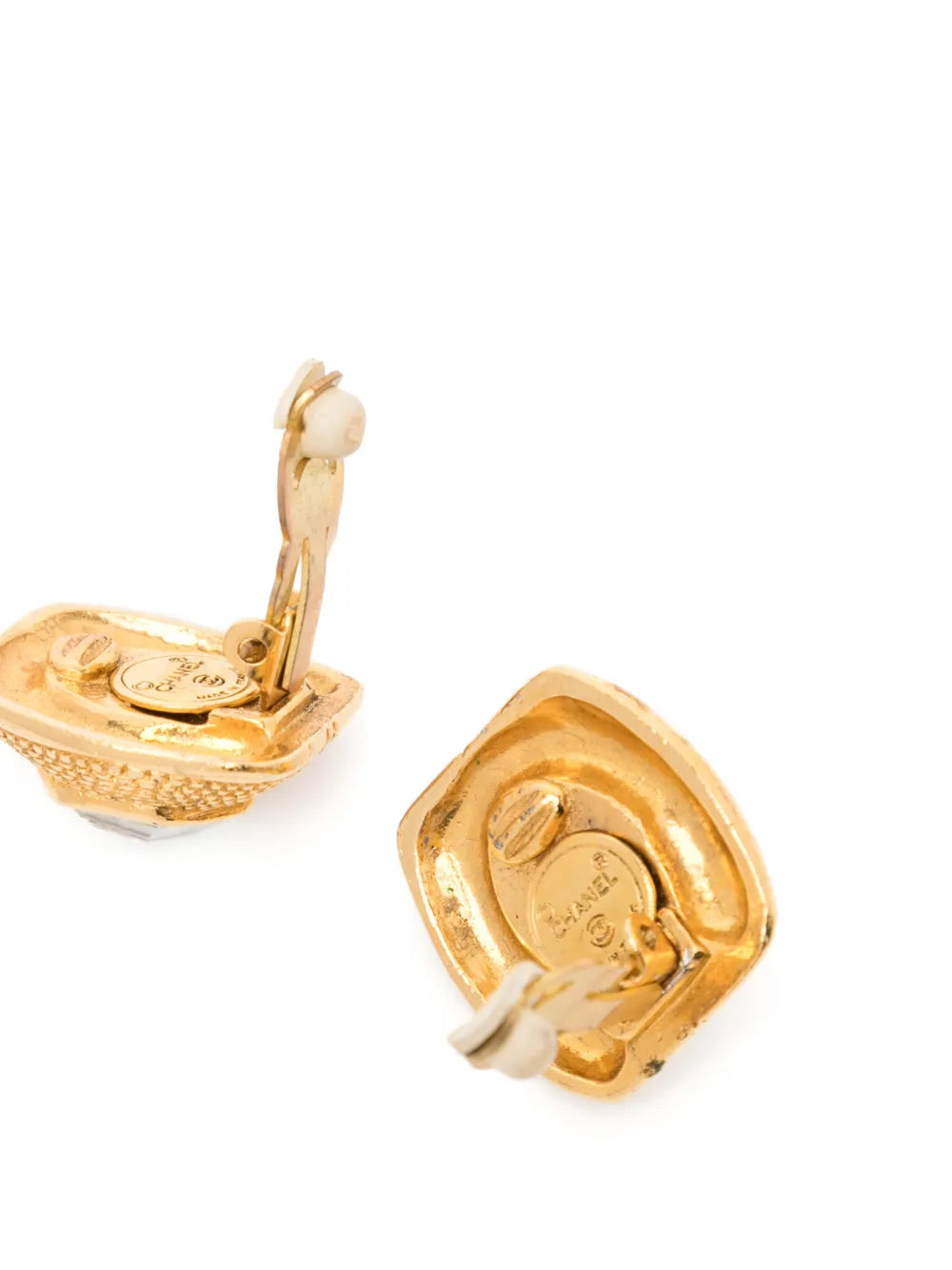 Vintage Chanel clip-on earrings from the 1990s featuring elegant gold-tone design and classic style.