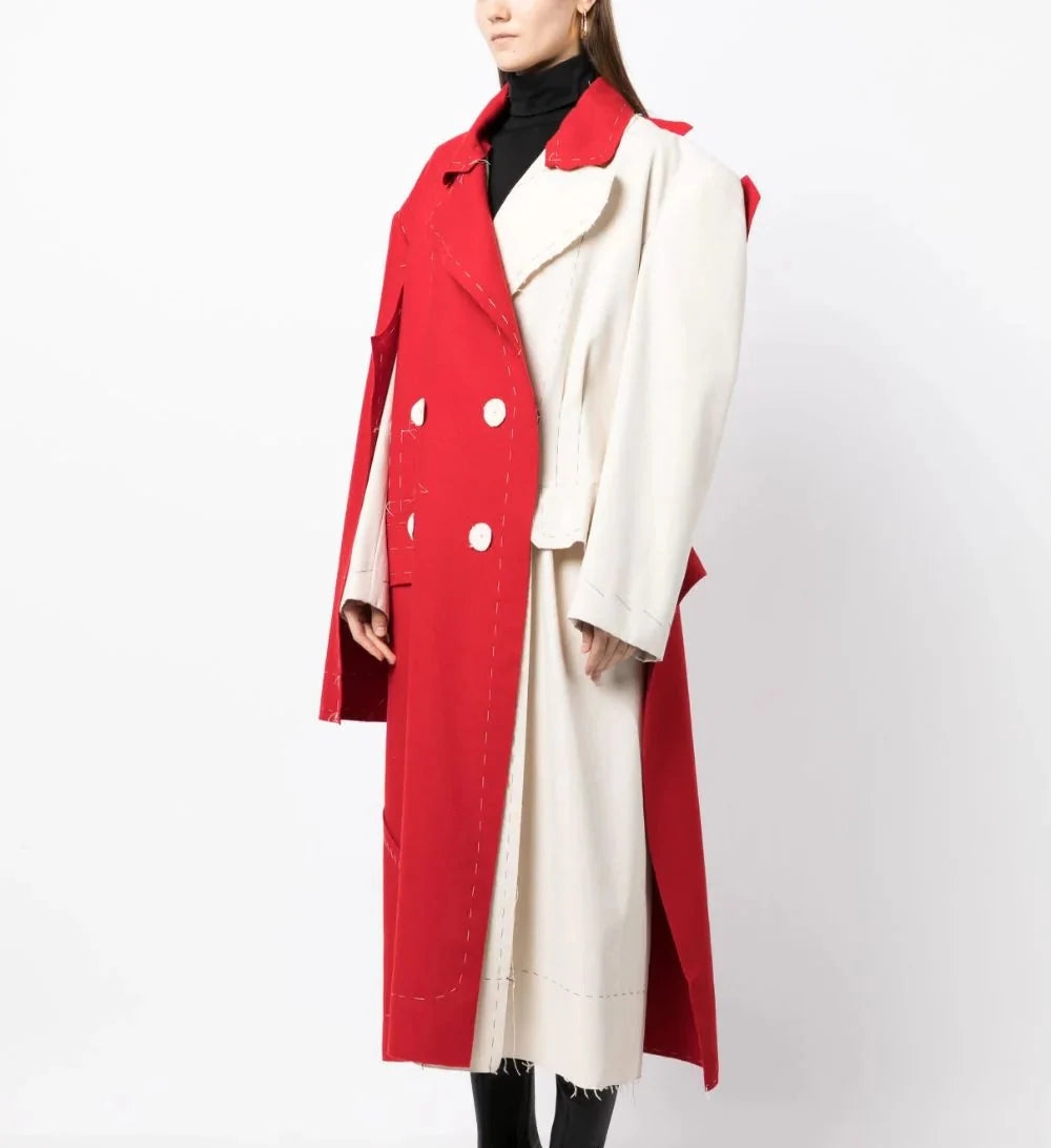 Maison Margiela deconstructed coat with layered design, featuring unique stitching and modern silhouette, on a neutral background.