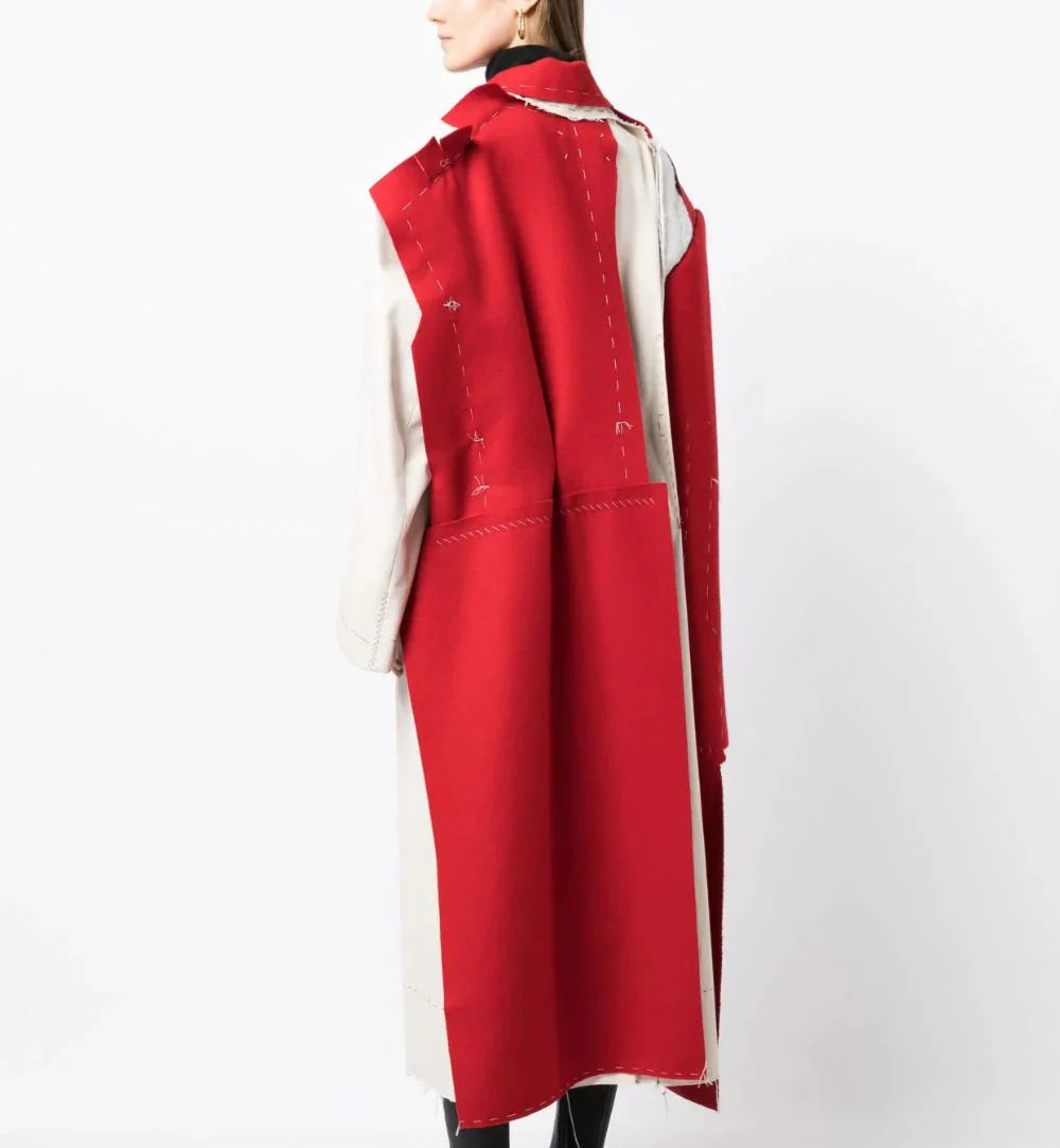 Maison Margiela deconstructed coat featuring layered fabric and unique design details, stylish outerwear for modern fashion.