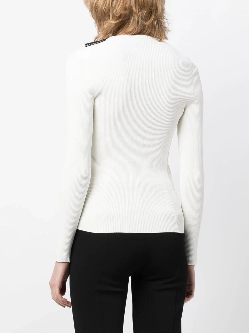 Balenciaga ribbed knit long-sleeved top with fitted silhouette and textured fabric, displayed on a plain background.
