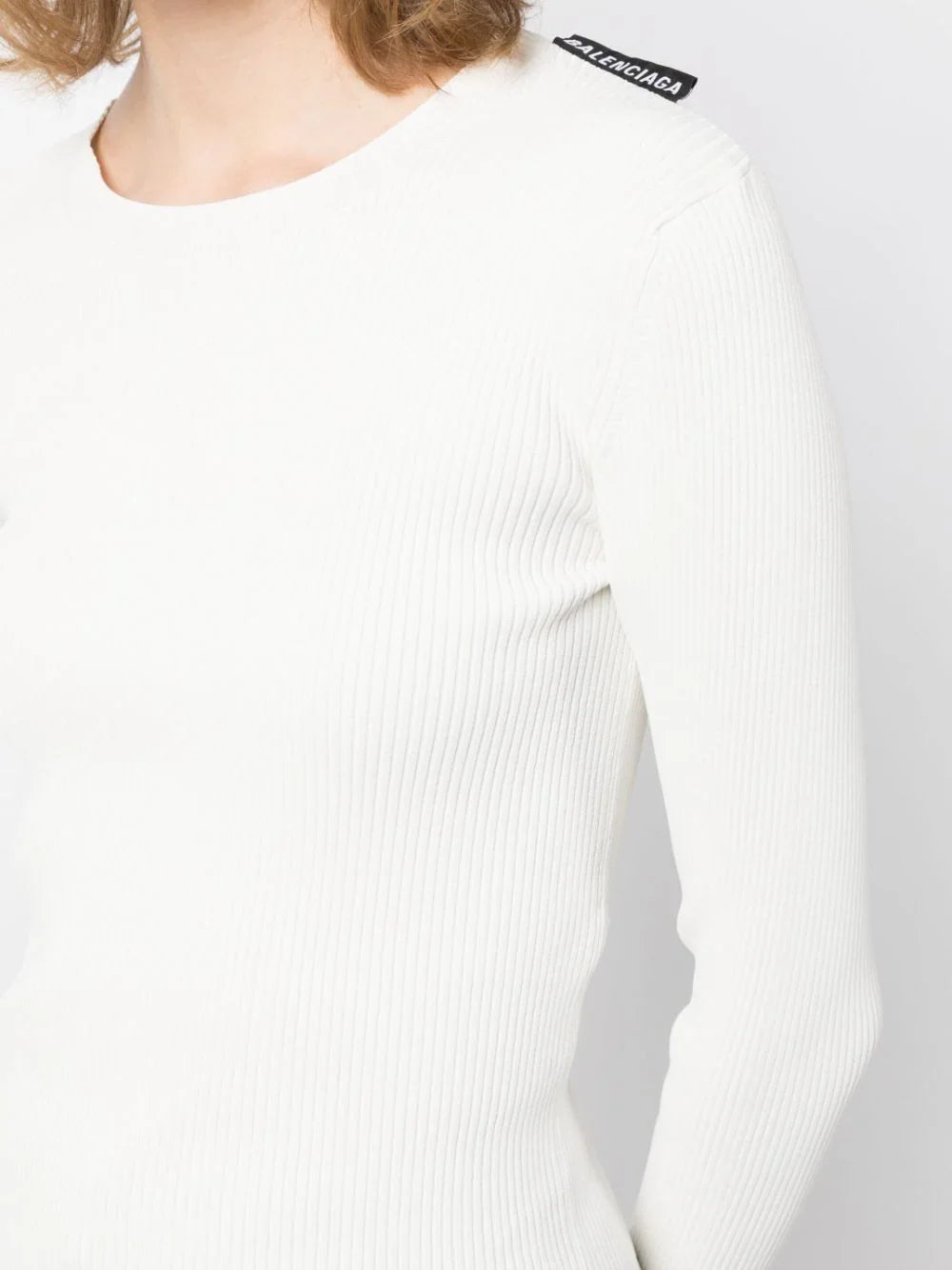 Balenciaga ribbed knit long-sleeved top, close-up of black textured fabric and fitted design, casual and stylish clothing for women.