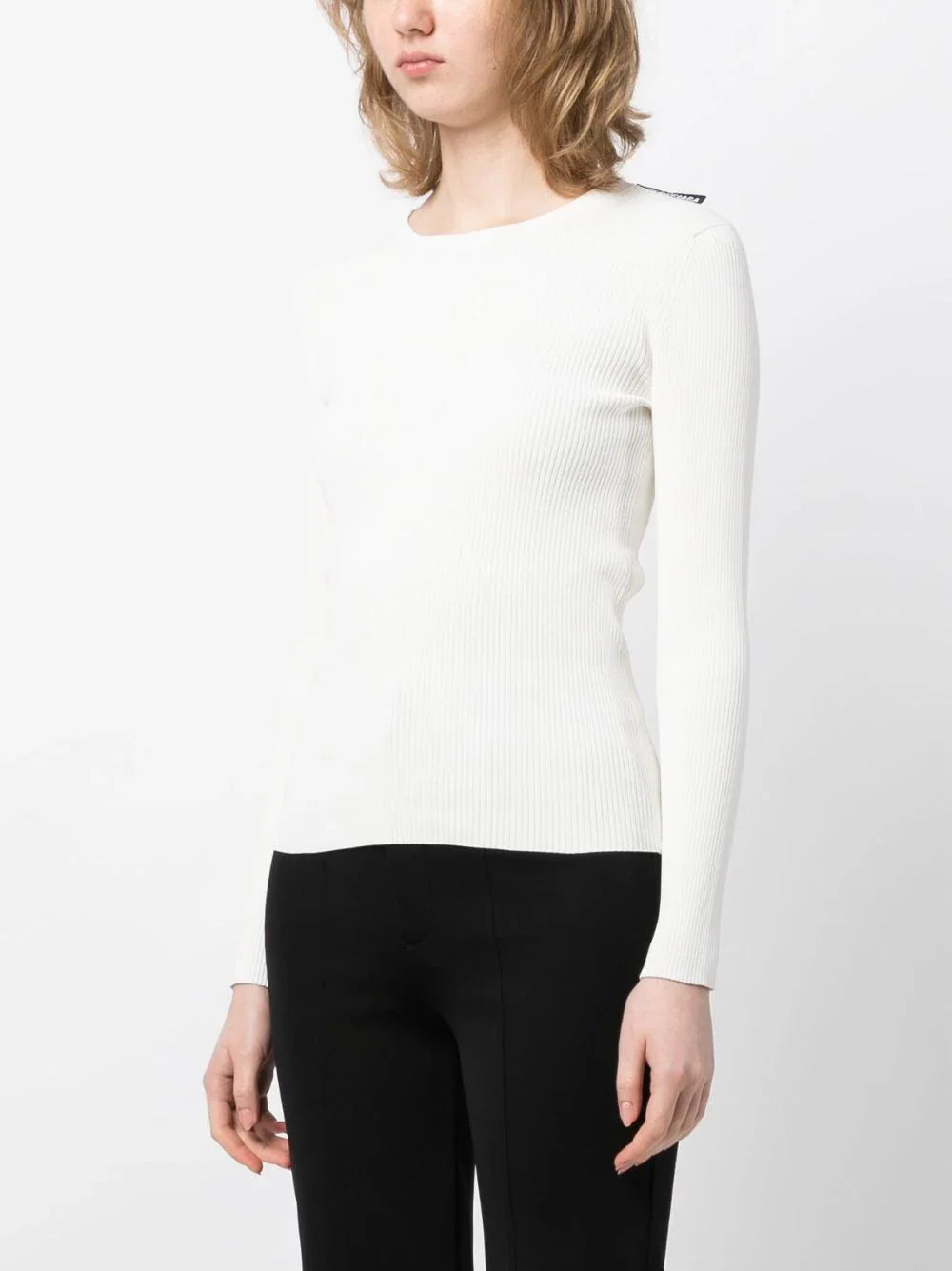 Balenciaga ribbed knit long-sleeved top, close-up of black textured fabric with fitted style and round neckline.
