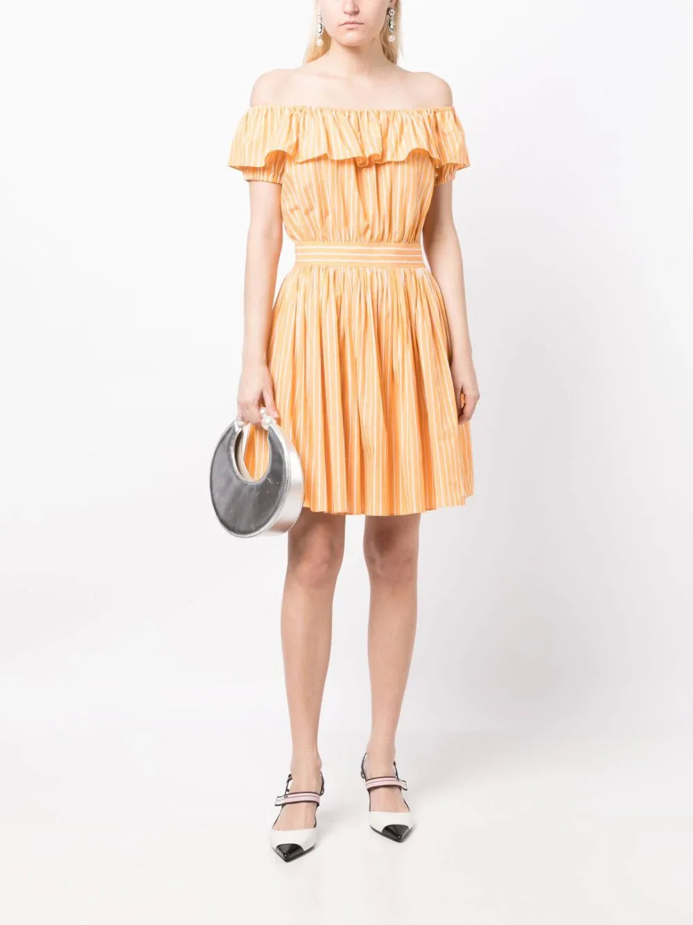 Miu Miu off-shoulder ruffle dress with flowing fabric and elegant design, featuring layered ruffles on the neckline.