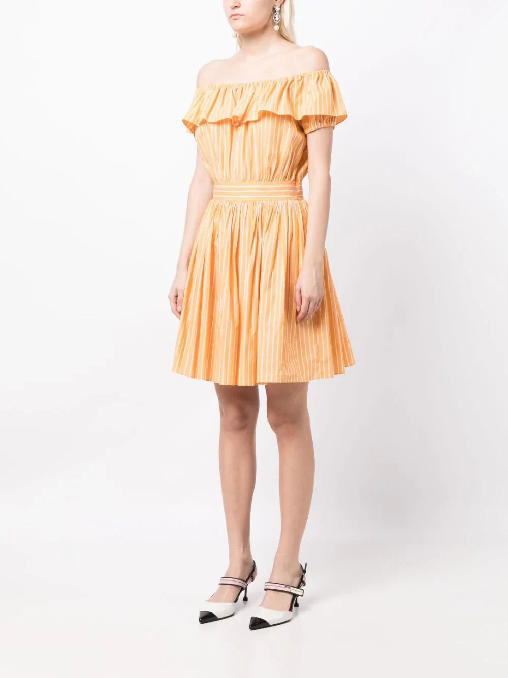 Miu Miu off-shoulder ruffle dress with flowing fabric and layered ruffle details, perfect for elegant summer occasions.