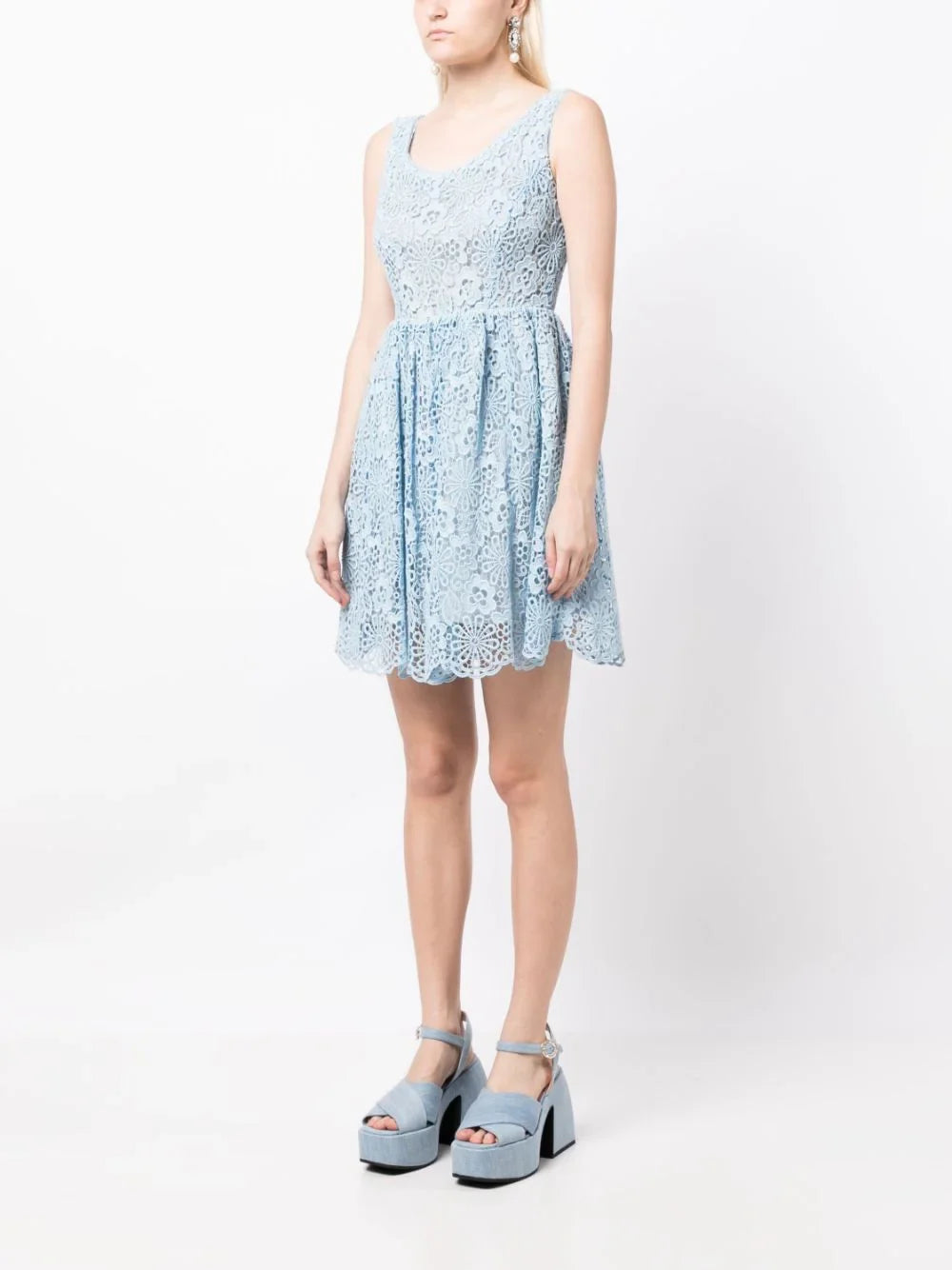 Miu Miu Guipure lace dress with intricate floral patterns, sleeveless design, and elegant fit for stylish occasions.
