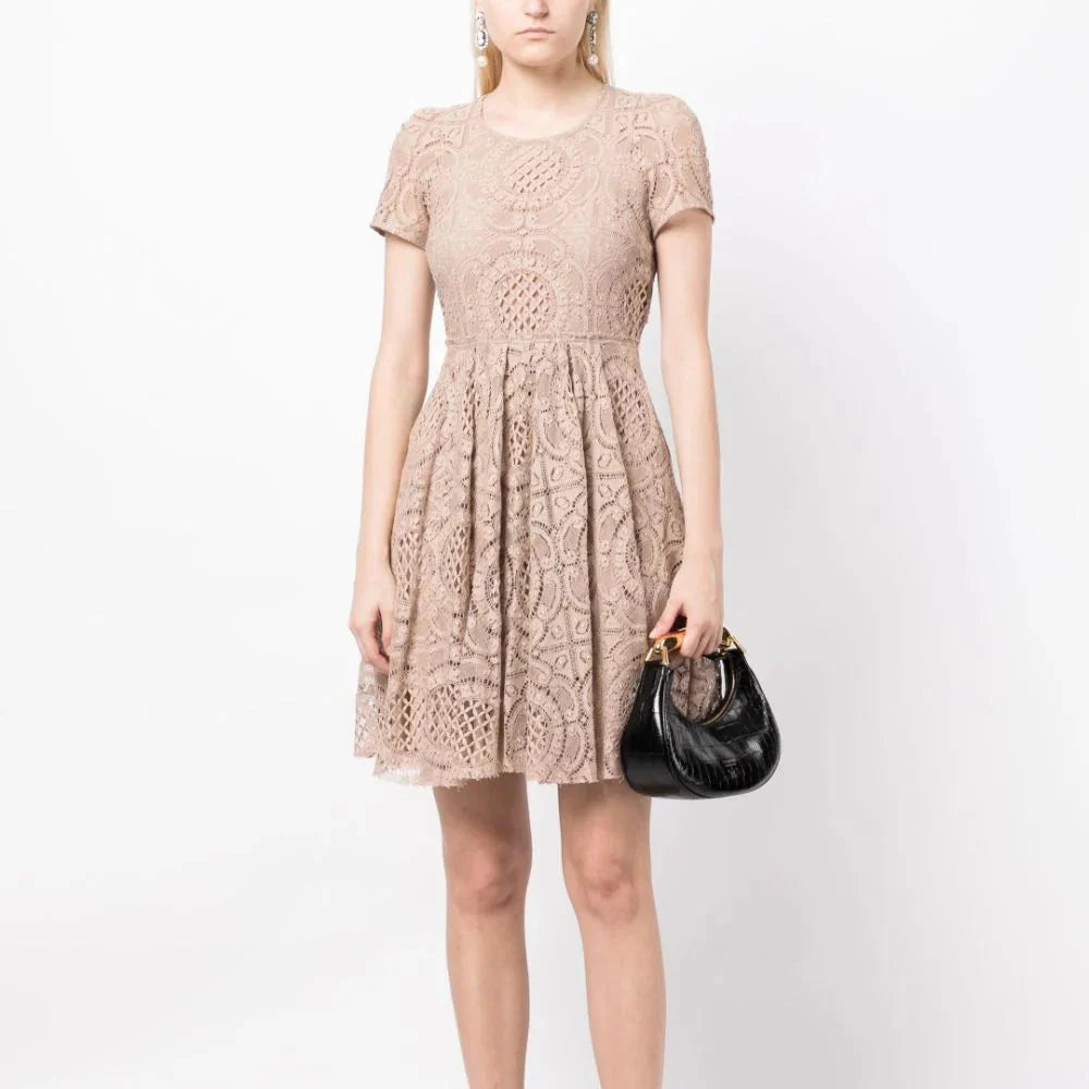 Elegant Burberry lace dress with intricate lace detailing, fitted silhouette, and classic design perfect for formal occasions.