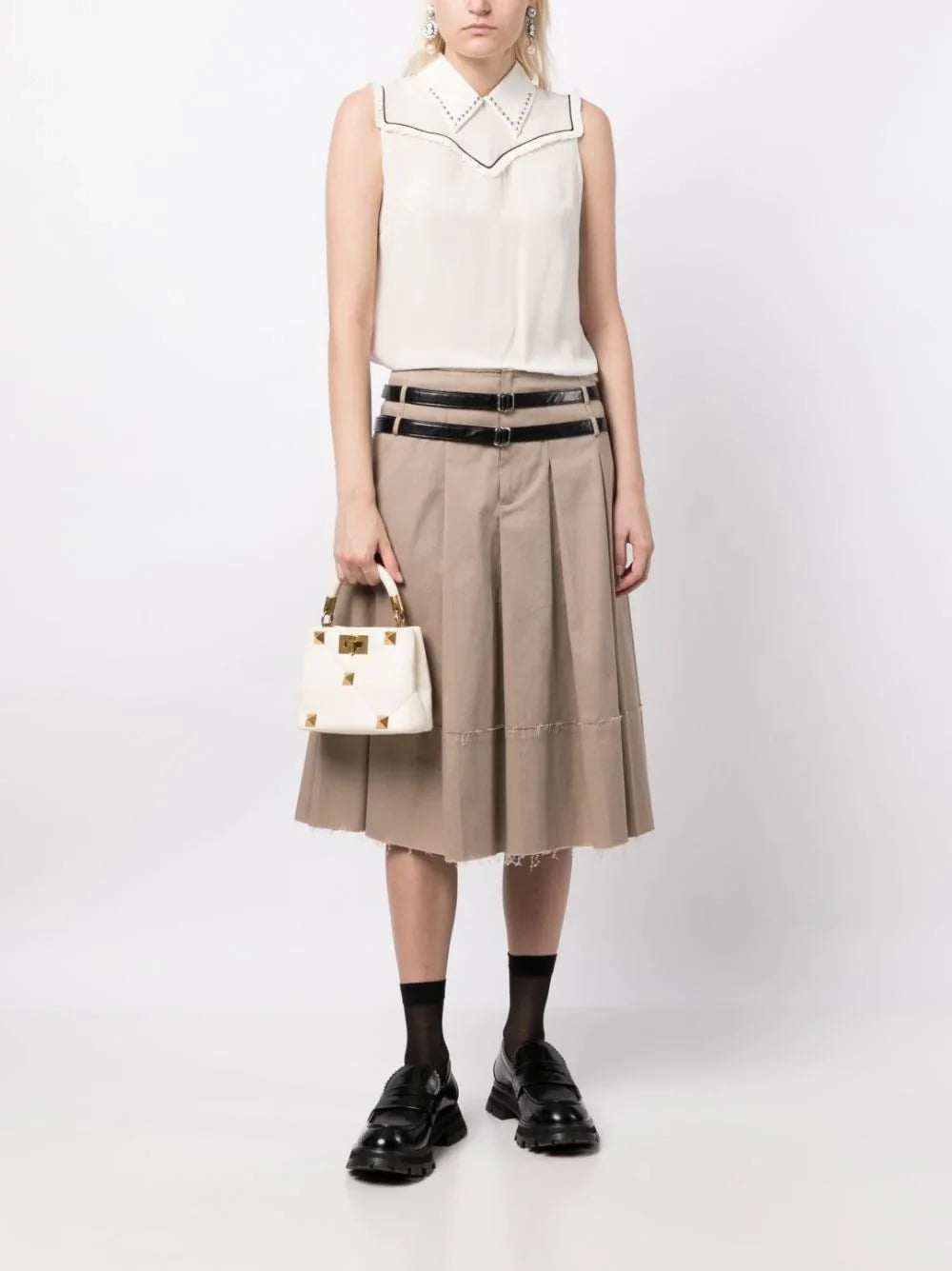 Miu Miu studded sleeveless blouse with a fitted design, featuring metallic stud details on soft fabric.