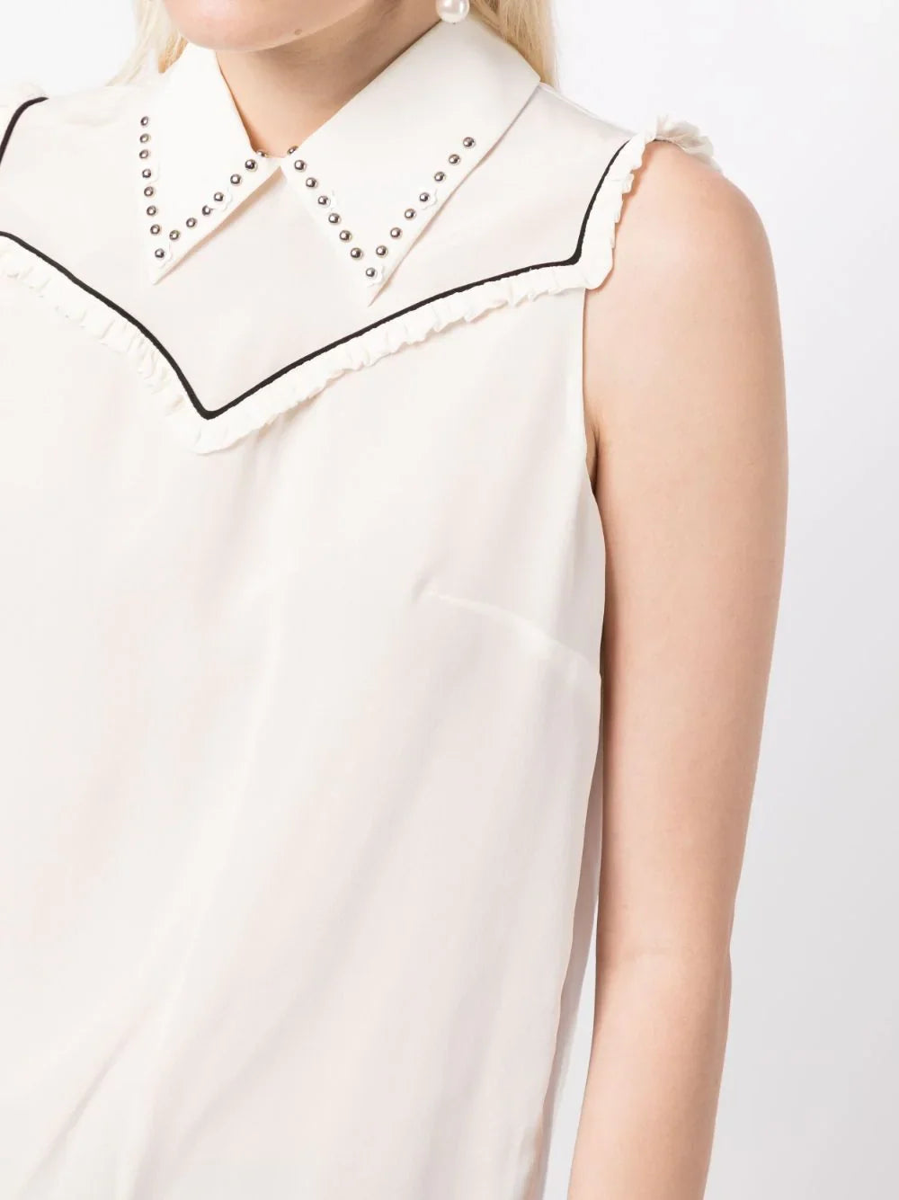 Miu Miu studded sleeveless blouse with a fitted design and decorative metal studs, perfect for stylish tops.