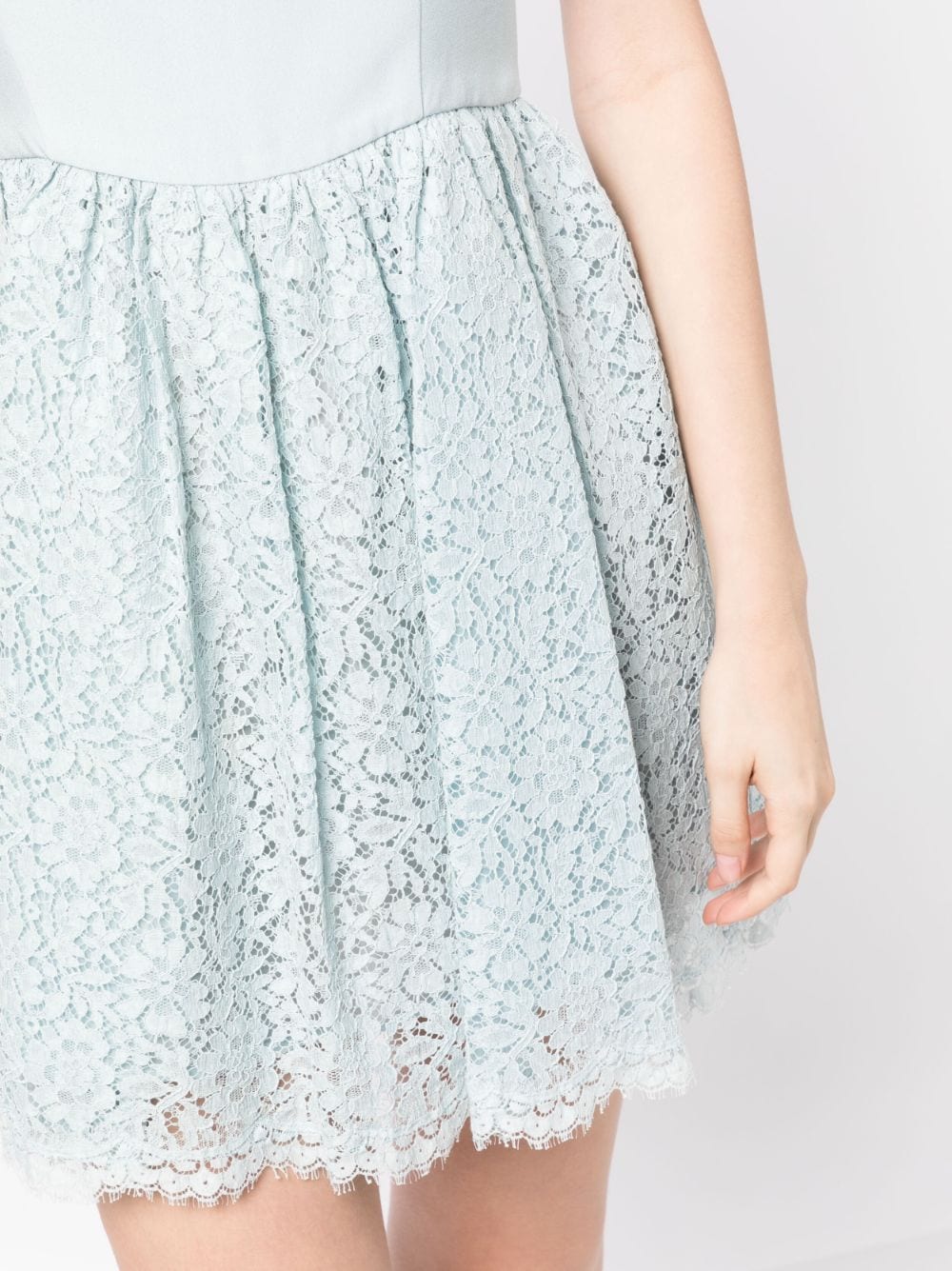 Miu Miu lace A-line dress with delicate floral embroidery, sleeveless design, and elegant silhouette.