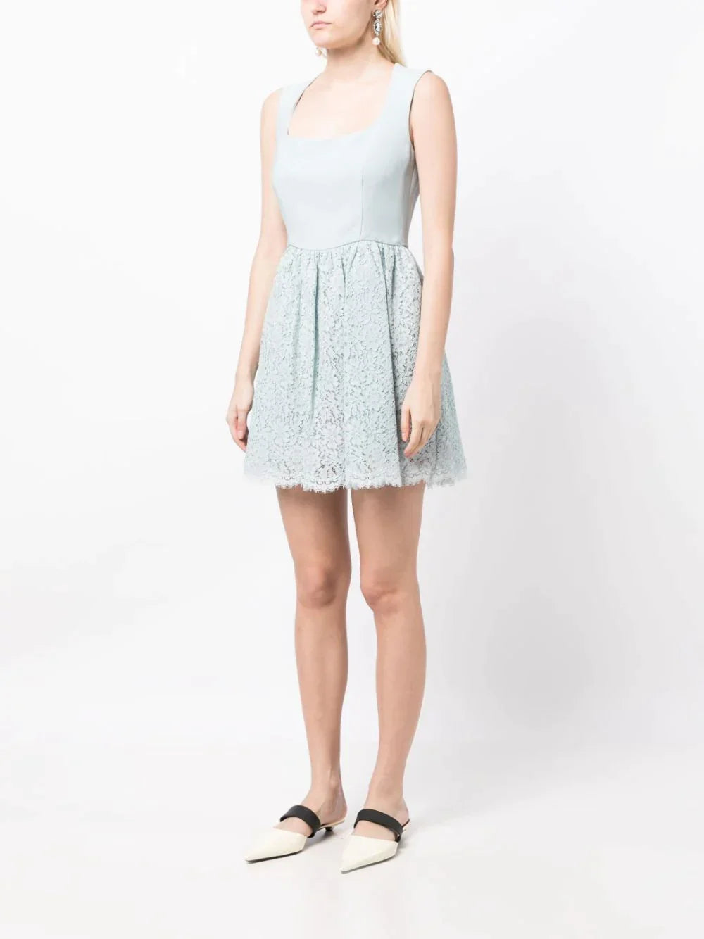 Miu Miu lace A-line dress with intricate lace detailing and a fitted waist, displayed on a mannequin.
