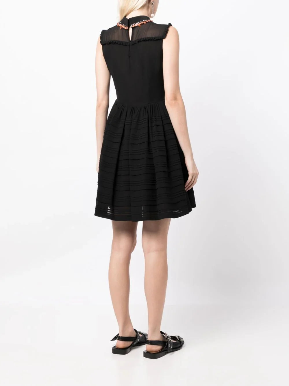 Miu Miu sleeveless dress with collar embellishments and elegant design, showcased on a hanger.
