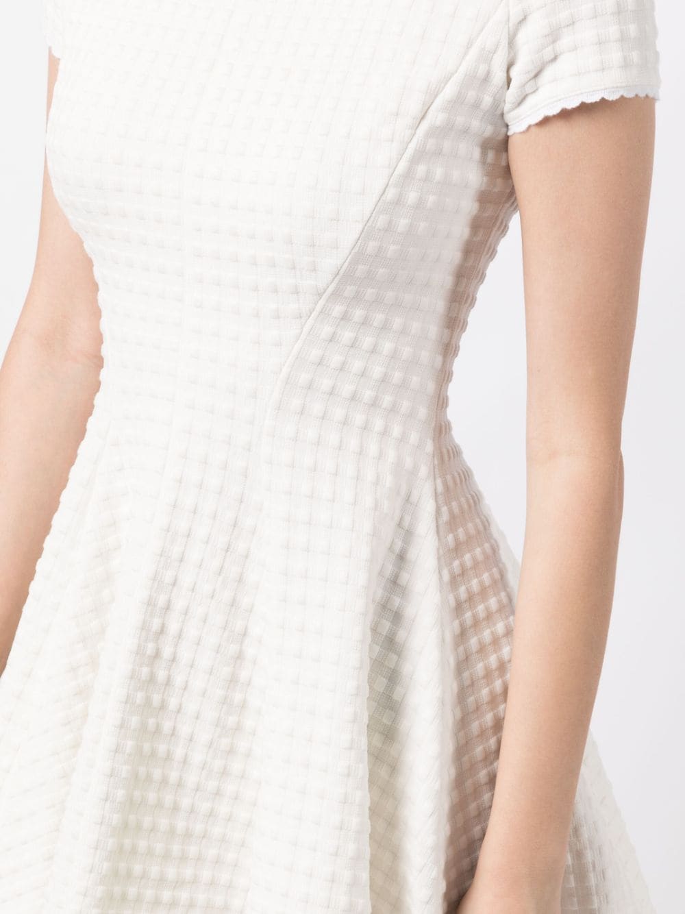 Miu Miu Jacquard A-line dress with intricate pattern and elegant silhouette, displayed on a dress form.