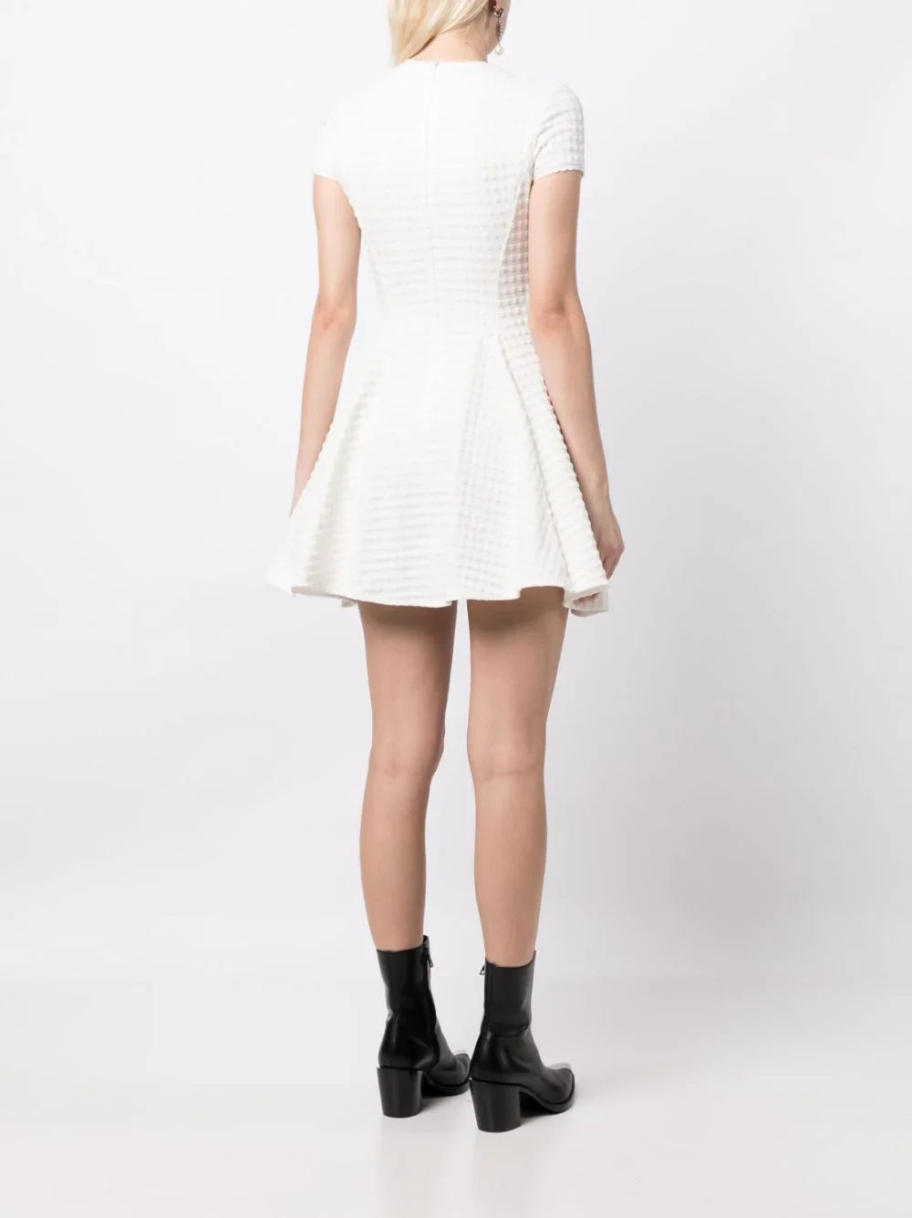 Miu Miu Jacquard A-line dress with intricate woven pattern and elegant silhouette, shown on a neutral background.