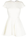Miu Miu Jacquard A-line dress with intricate woven pattern, sleeveless design, and elegant silhouette.