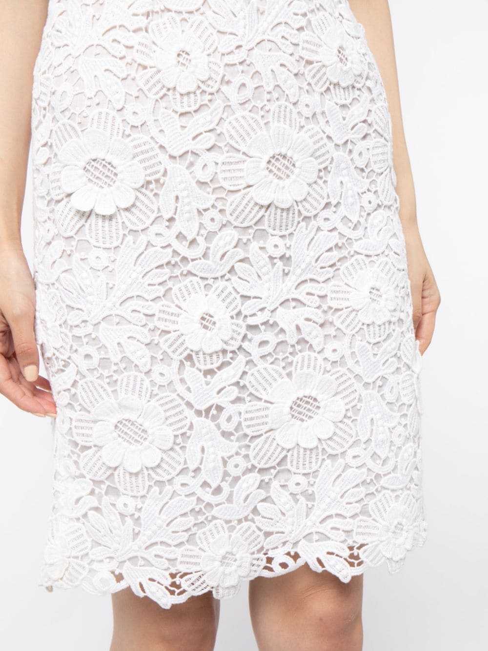 Prada floral broderie anglaise special edition dress with intricate embroidery and delicate fabric, perfect for elegant occasions.