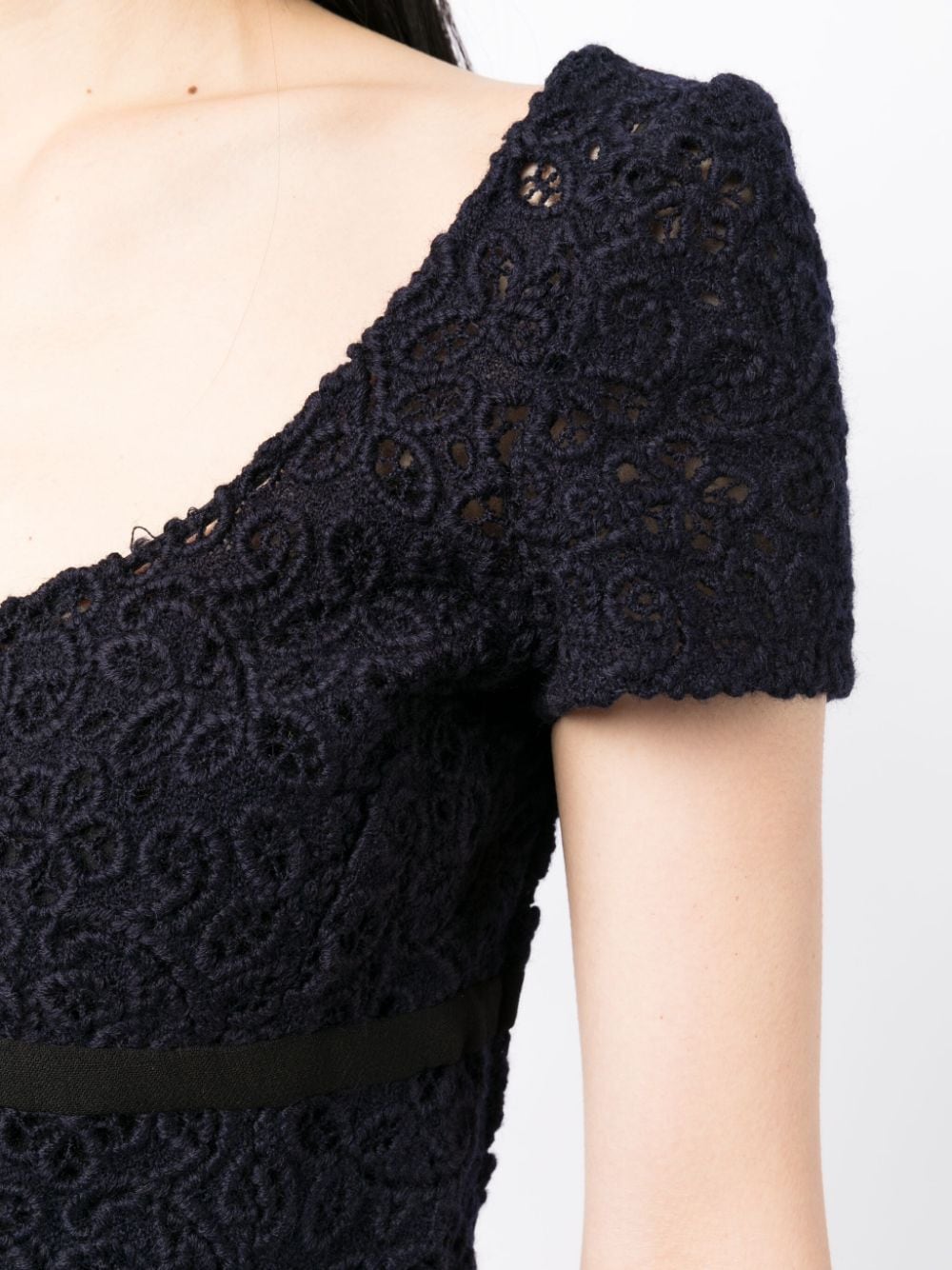 Prada empire waist floral lace dress with fitted bodice and flowing skirt, elegant evening wear for special occasions.