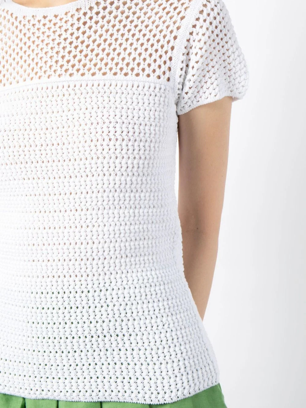 Prada short-sleeved crochet top featuring intricate knit pattern, lightweight fabric, and stylish design perfect for casual wear.