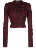 Prada chunky knit cardigan, cozy long-sleeve tops in soft textured wool with a relaxed fit, neutral color, and ribbed cuffs.