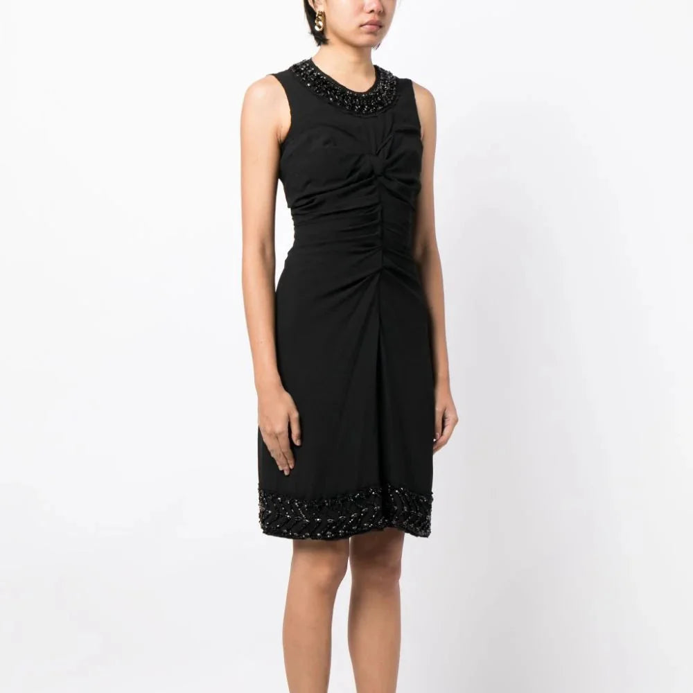 Prada sleeveless corset ruched dress featuring a fitted silhouette and elegant design, perfect for formal occasions.