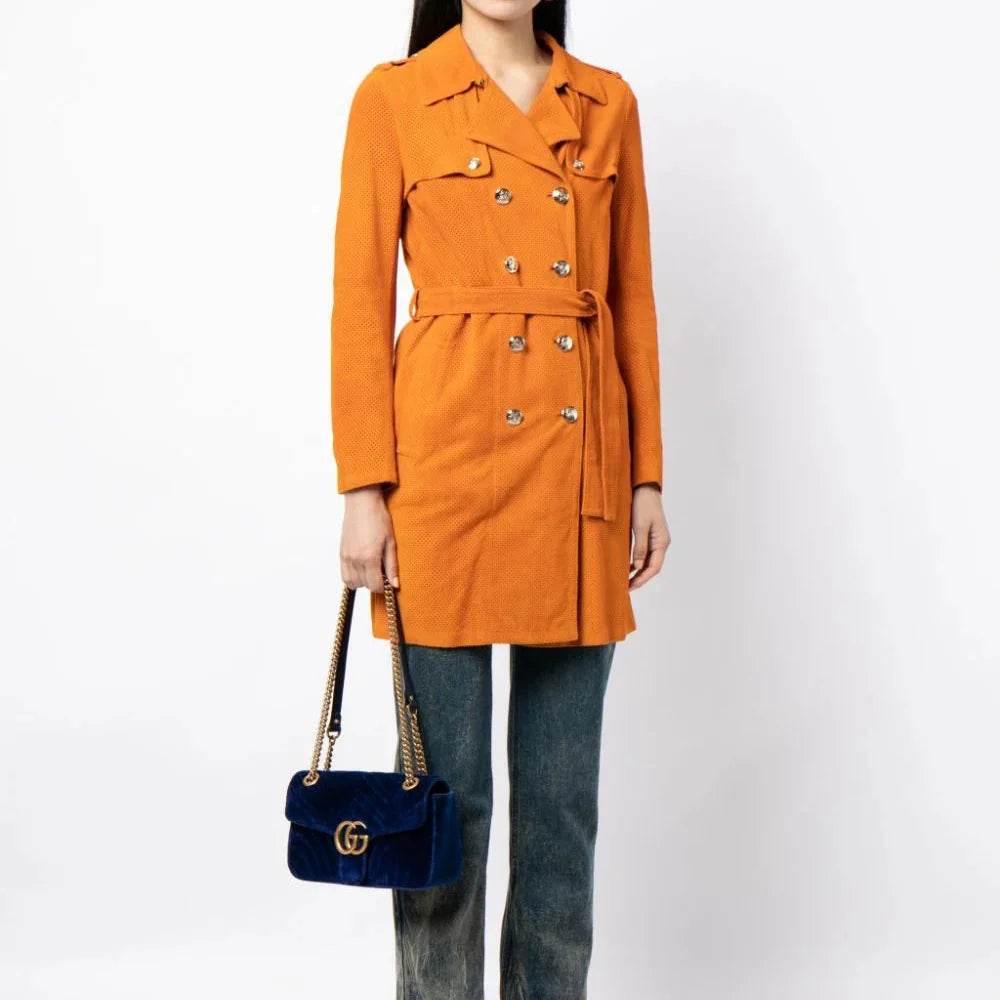 Gucci suede trench coat displayed on a hanger, showcasing the luxurious beige material and classic design details.