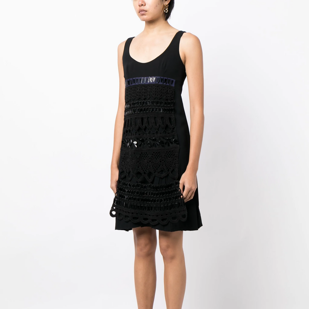 Prada 2005 panelled sleeveless dress with structured design and elegant fabric, shown on a hanger.