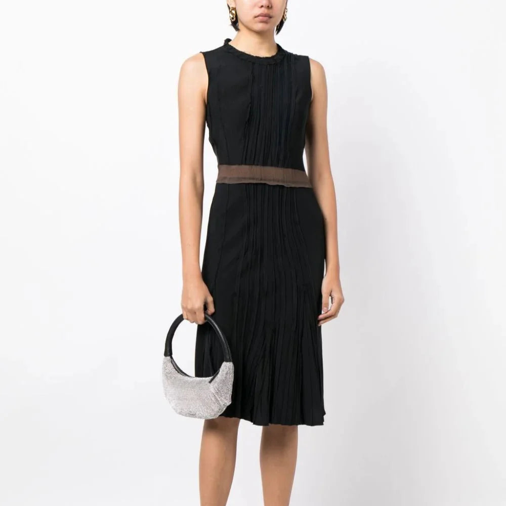 Prada pleated sleeveless silk dress with elegant draping and a fitted waist, showcased on a mannequin.