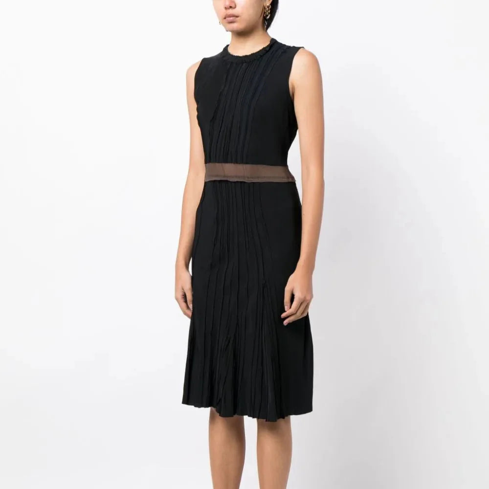 Prada pleated sleeveless silk dress with a flowing design and elegant pleats, showcasing a sophisticated and luxurious style.