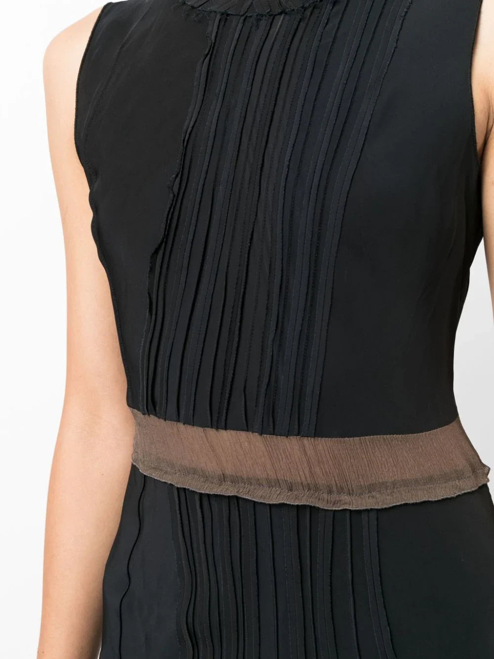 Prada pleated sleeveless silk dress with a flowing design and elegant silhouette, shown in a close-up view.