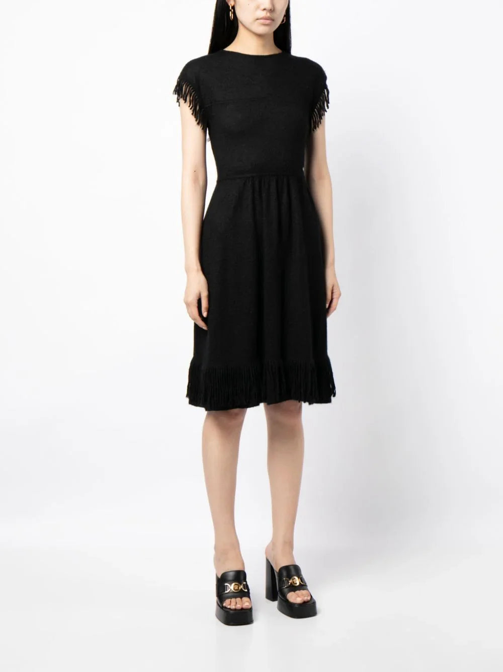Rewind Vintage Affairs fringed knit dress with textured fabric and boho style, featuring fringe details and a relaxed fit.