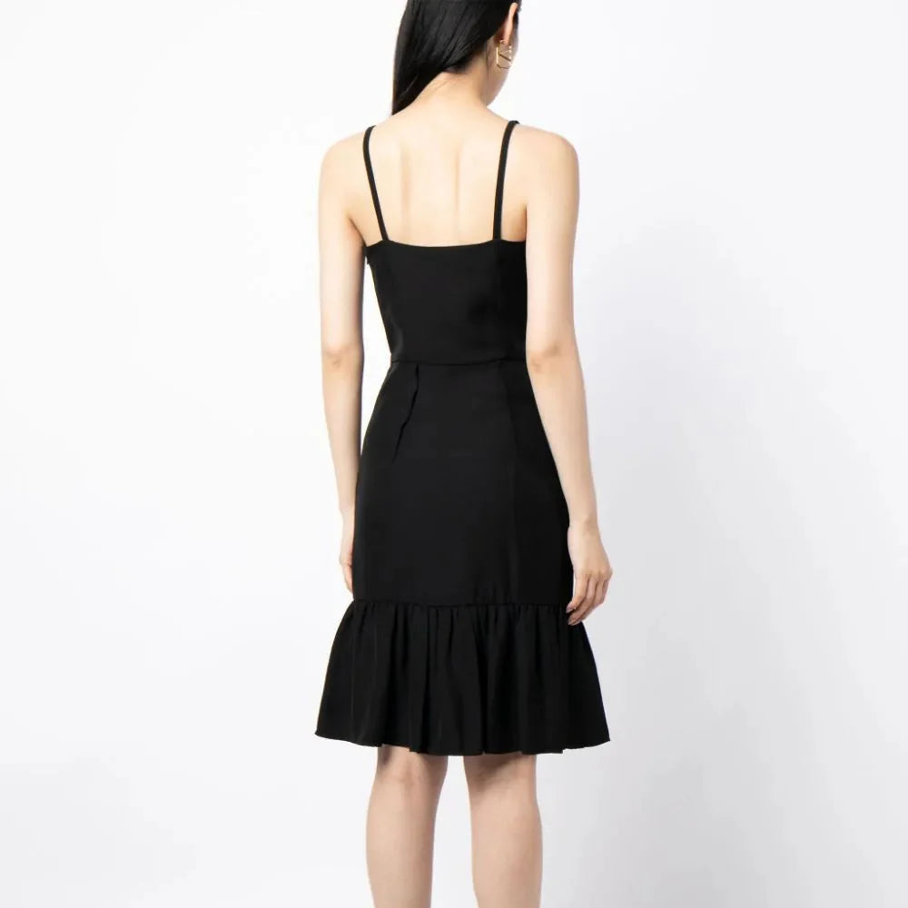 Prada ruffle hem crepe dress in navy with flowing silhouette and elegant details, shown on a model.