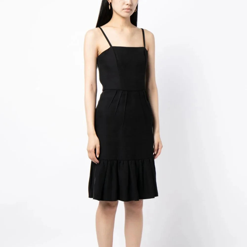 Prada ruffle hem crepe dress with elegant design, featuring a flowing silhouette and detailed ruffle accents.