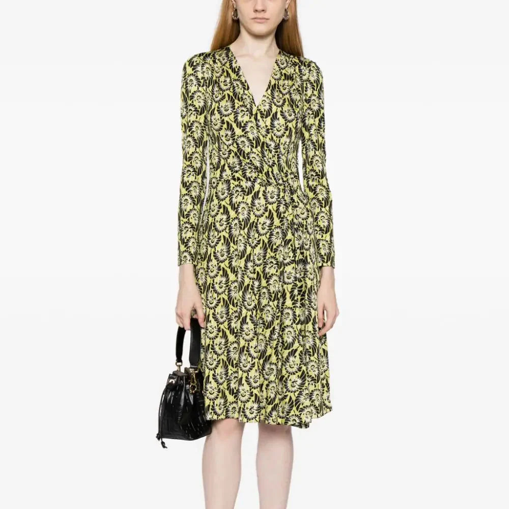 Prada abstract print silk wrap dress featuring vibrant colors and flowing fabric, perfect for elegant occasions.