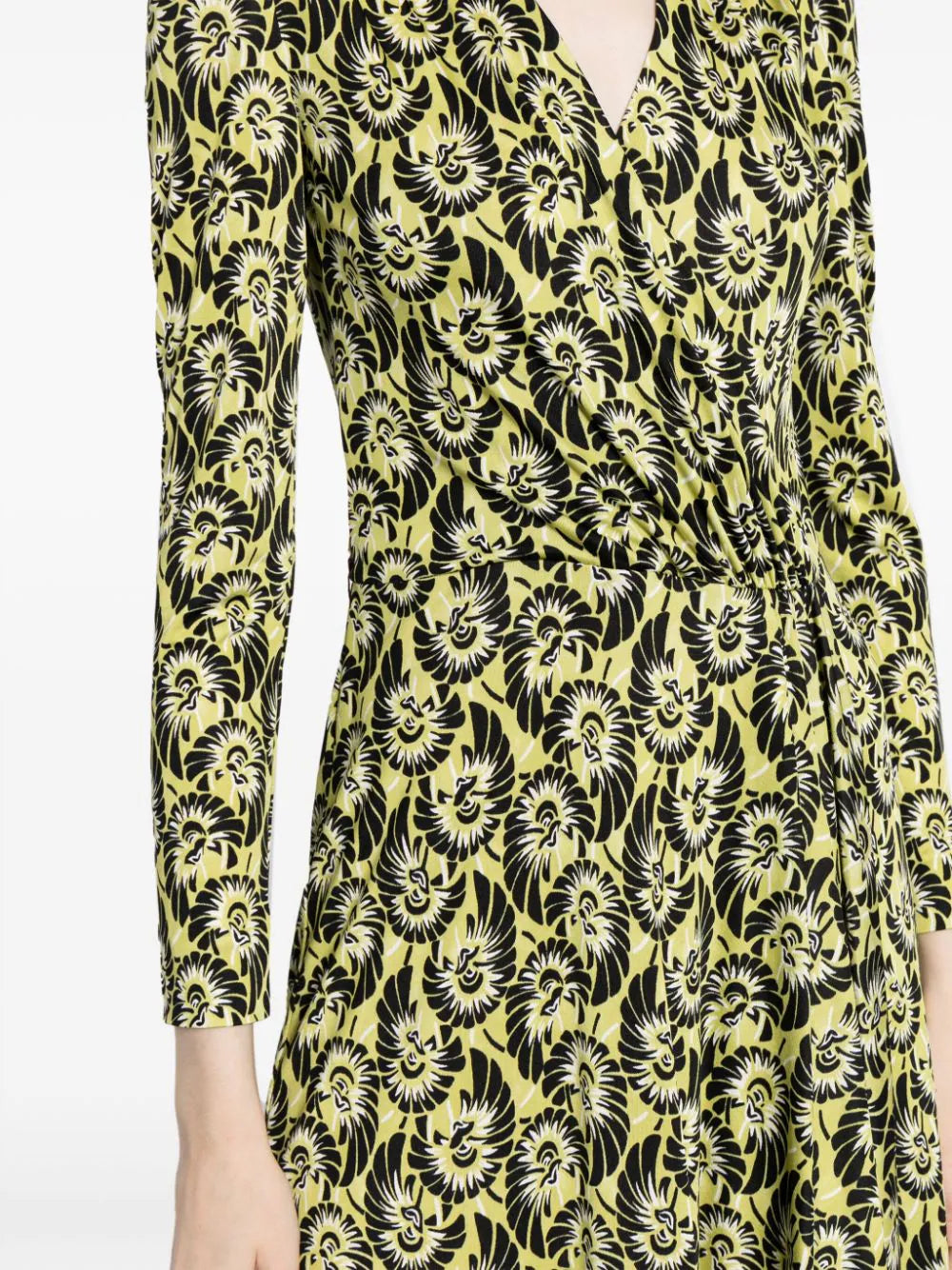 Prada abstract print silk wrap dress featuring vibrant colors and flowing fabric, perfect for stylish occasions.
