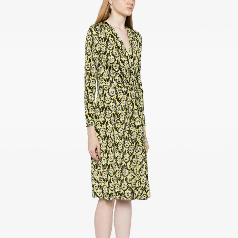 Prada abstract print silk wrap dress featuring vibrant colors and flowing fabric, perfect for elegant occasions.