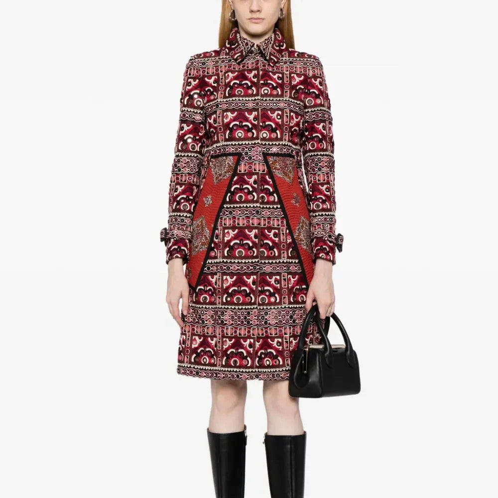 Burberry Fall 2015 embroidered trench coat with classic beige fabric and detailed embroidery on the front and sleeves.