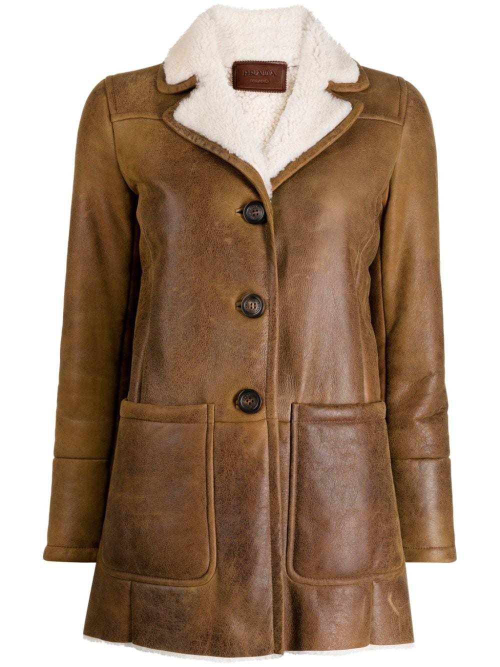 Prada shearling jacket with soft fur lining and stylish design, perfect for cold weather, displayed on a mannequin.