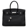 Hermès Birkin 35 Top Handle Bag in black Clemence leather with gold hardware, showcasing its elegant design and structured silhouette.