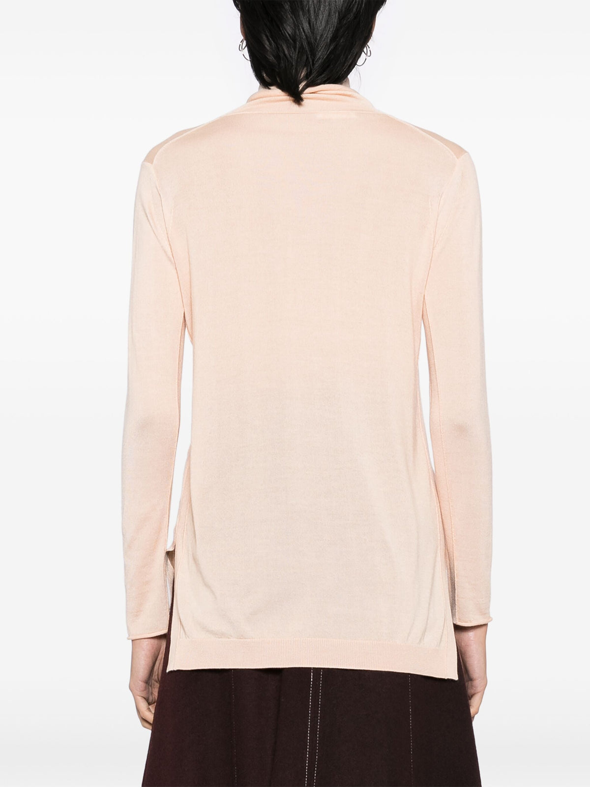 Chloé peach cashmere turtleneck jumper, soft and cozy tops, close-up of the warm, luxurious knit fabric and high neckline.