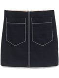 Chloé SS16 navy mini skirt with high waist and pleated design, made of lightweight fabric, styled on a model.